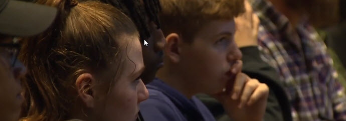 students sitting in auditorium